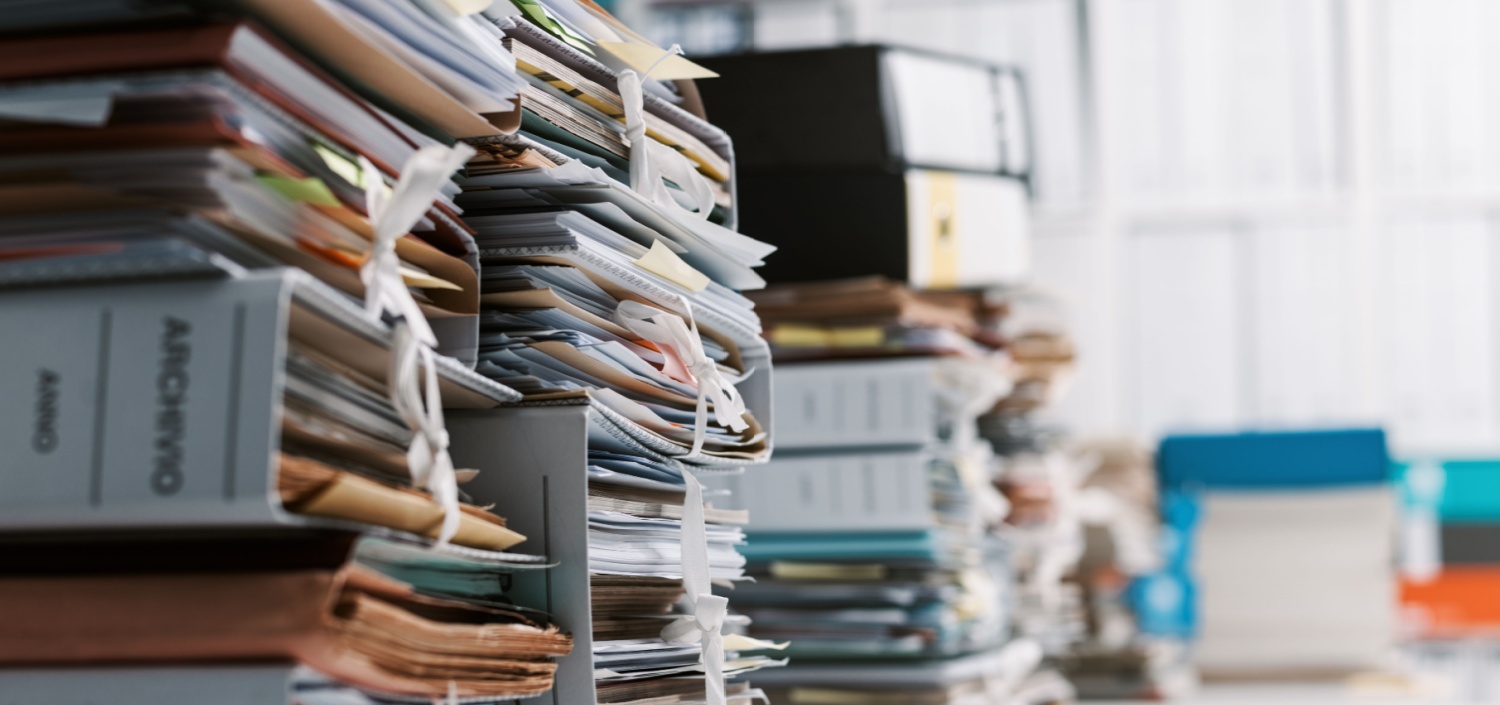 large stack of files and folders | survive your first compliance engagement