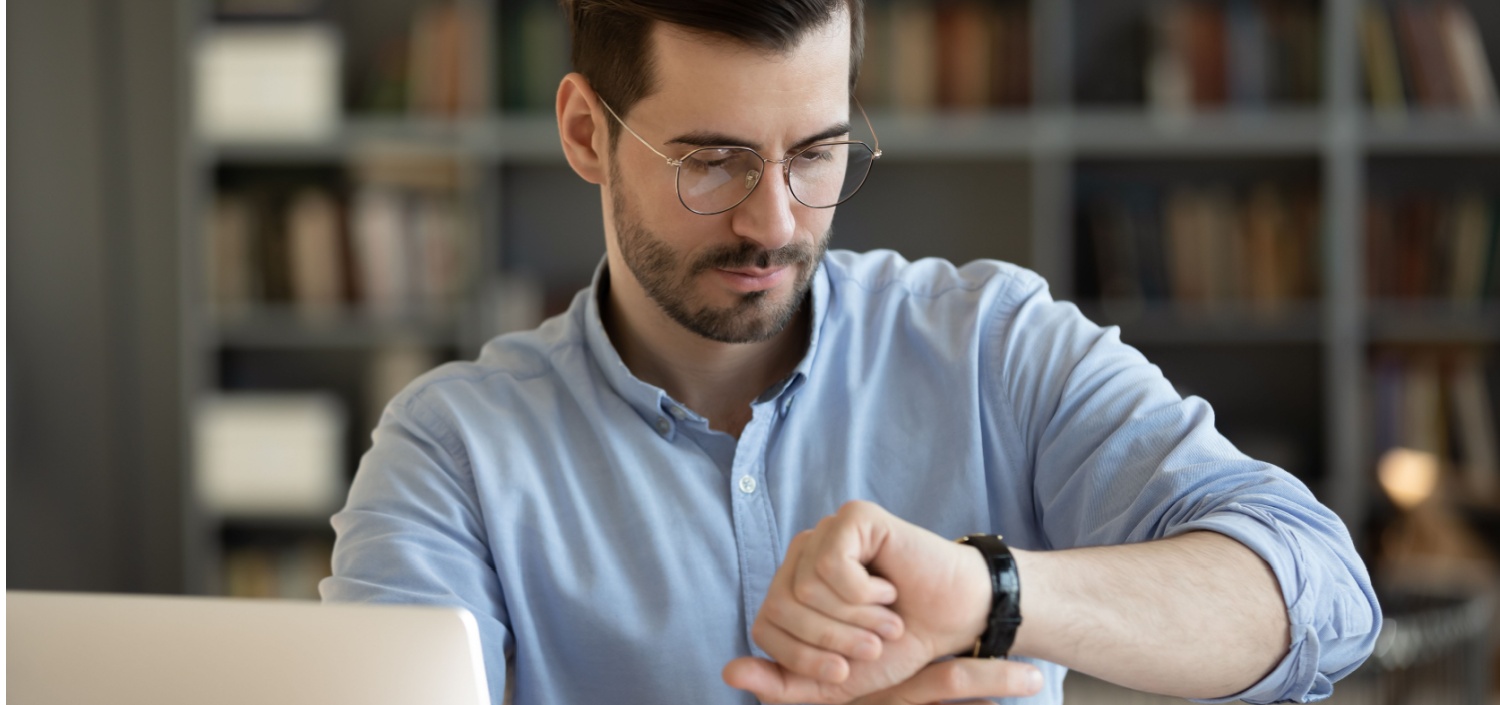 businessman checking his watch | How Long Will Your First Compliance Certification Take?